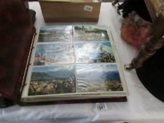 A postcard album with in excess of 400 UK and world postcards