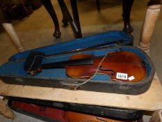 An early 19th century cased violin and bow,