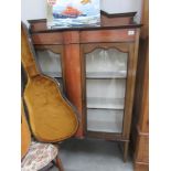 An Edwardian inlaid display cabinet