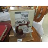 A boxed Essex small sewing machine