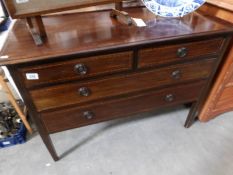A mahogany inlaid 2 over 2 chest of drawers