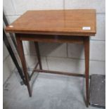 An Edwardian mahogany inlaid fold over card table