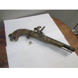 An ornamental flintlock pistol