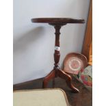 A tripod wine table