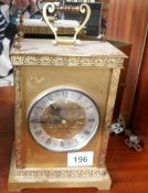 A brass mantel clock