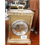 A brass mantel clock