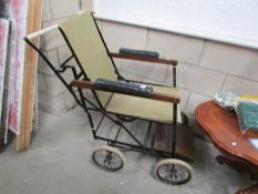 An early 20th century wheel chair