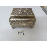 A good quality late Victorian jewellery casket embossed with cherubs