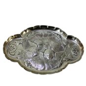 A silver pin tray depicting cherubs by William Comyns, London 1899, 1.