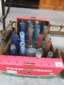 A box of hand made glass vases