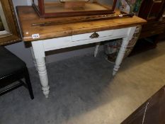 A pine table with painted base