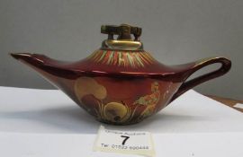 A Carlton ware 'Rouge Royale' table lighter in the form of Aladdin's lamp (chip on spout)