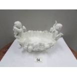 A 19th century hard paste bowl surmounted cherubs
