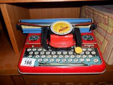 A Mettype junior typewriter in original box