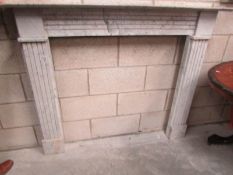 A white marble fire surround