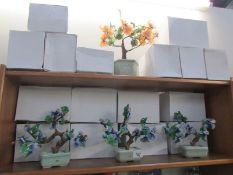 A quantity of ornamental bonsai ornaments