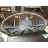 An Indian oval table top with bone inlay scene of the Taj Mahal