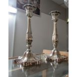 A pair of good quality silver plate candlesticks