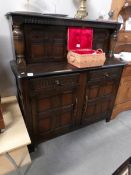 An oak court cupboard