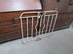 A vintage metal stair gate