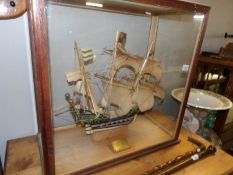 A cased model of a galleon with presentation plaque reading 'presented to Miss Wren,