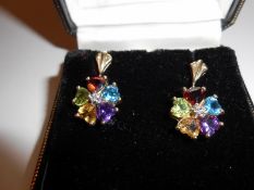 A pair of 9ct gold earrings set with multi coloured stones including citrine, amethyst,