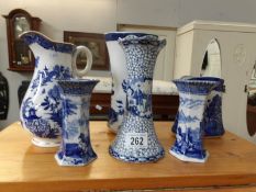 A collection of blue and white vases and jugs