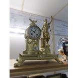 A French gilded mantel clock surmounted figure,
