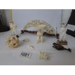 A collection of oriental bone items including puzzle ball