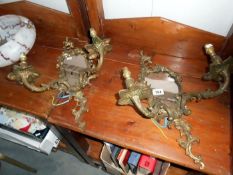 A pair of gilt wall lights with mirrors