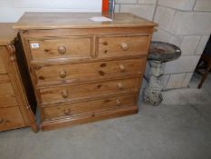 A 2 over 3 pine chest of drawers