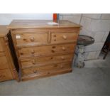 A 2 over 3 pine chest of drawers