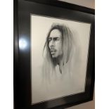 A signed framed and glazed portrait print of Bob Marley