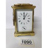 A French brass carriage clock complete with key and with alarm