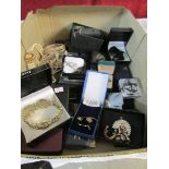 A mixed lot of costume jewellery including necklaces,
