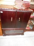 A mahogany effect television cabinet