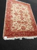 A beige ground Ziegler rug,