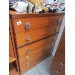 A teak 5 drawer chest