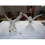 A glass owl figure and a glass eagle as a clock