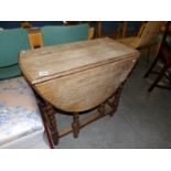 An oak barley twist gate leg table