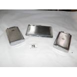 3 cigarette cases with lighters