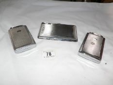 3 cigarette cases with lighters