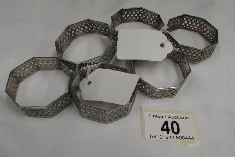 A set of 6 piercework white metal napkin rings