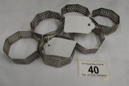 A set of 6 piercework white metal napkin rings