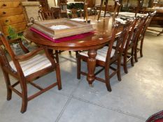 A large extending dining table with 2 leaves and 8 chairs