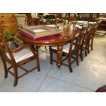 A large extending dining table with 2 leaves and 8 chairs