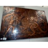 A copper plaque depicting Saint George slaying the dragon by Chris Bird