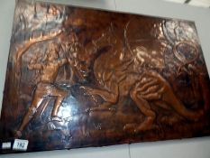 A copper plaque depicting Saint George slaying the dragon by Chris Bird