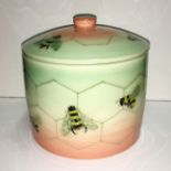 A Dennis china works lidded pot decorated with bees