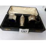 A cased silver cruet set